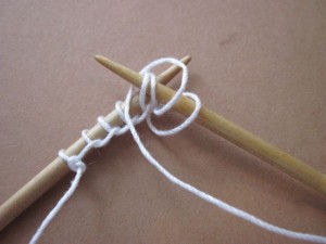 wrap (or pick) yarn to make the p2tog in the usual way