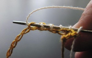 Pull a loop of lace thread through the bumps on the back side of a crochet chain for each cast on stitch required