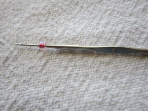 Inox size 8 steel crochet hook can be used with size 6/0 beads