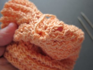 Pull yarn snugly to close the hole