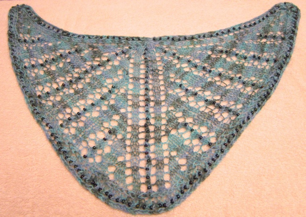 Even a minimal blocking will open up the lace and even out the stitches 