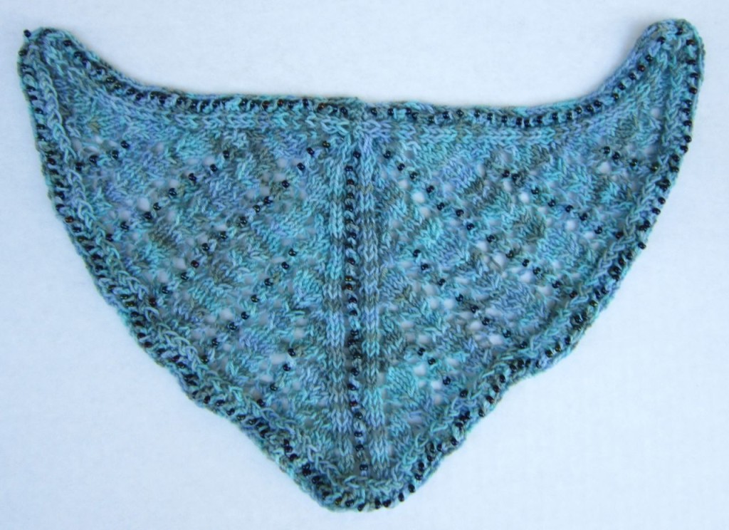 Unblocked shawl after center back neckline has been seamed