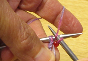 bring yarn over and around right-hand needle to front again to make yo