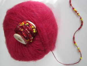 String beads on supplemental thread