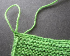 All stitches have been joined and only the loop from last stitch of 3-needle bind off remains