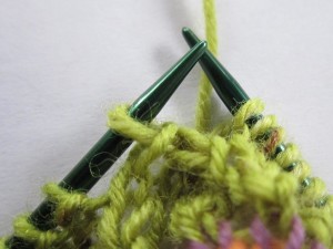 drop pulled-over stitch from right-hand needle