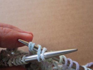 Ease the 4 stitches to the tip of the right-hand needle