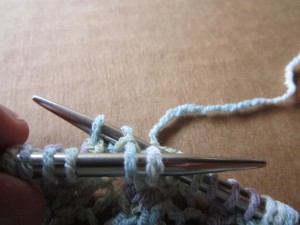 Insert right-hand needles into the 2 dangling stitches